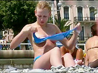 The raunchy bikini movie with pretty girl taking off bra on the beach!
